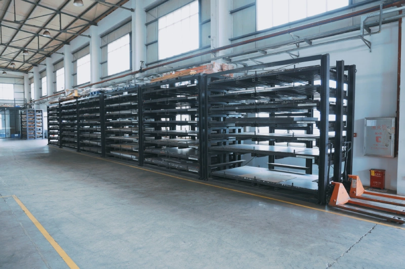Raw sheet metal stacks stored on industrial shelves ready for fabrication