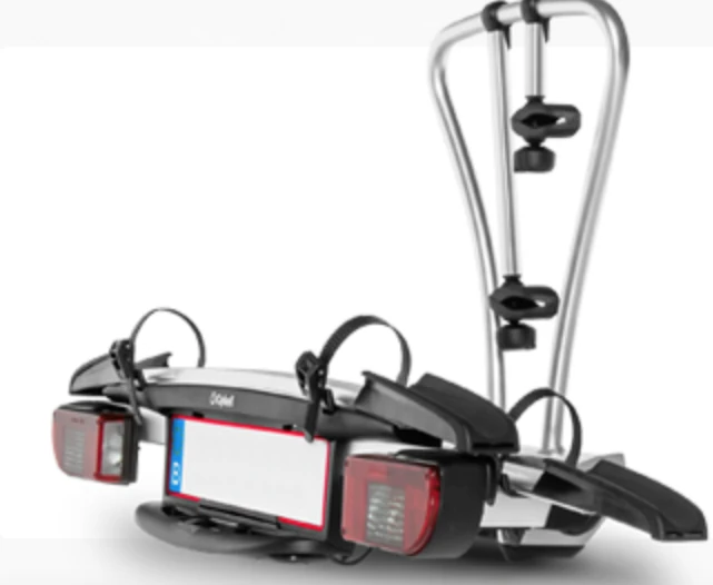 Towbar-mounted two-bike carrier with integrated rear lights and licence plate holder, manufactured by Komaspec