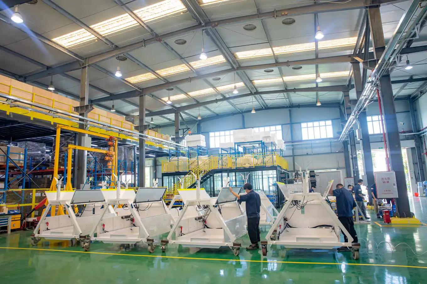 Workers inspecting units on a pilot production line during the PVT npi phase