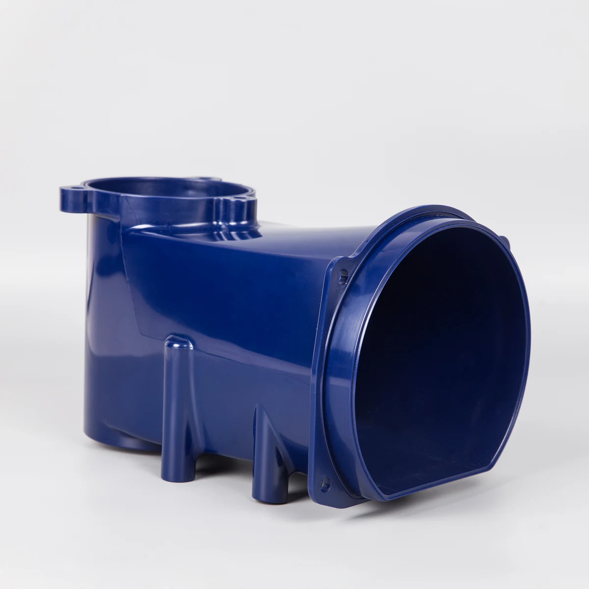 Blue molded plastic housing showing tapered draft angles, ribs, and varying wall sections